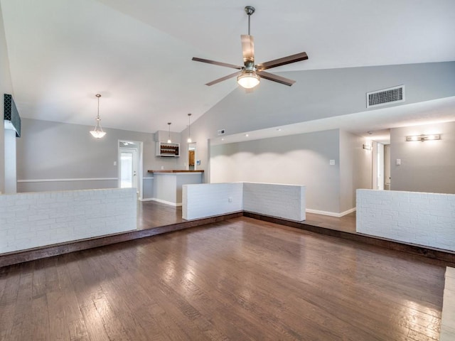 4552 Fremont Ln, Plano, TX 75093 - unfurnished living room with high vaulted ceiling, ceiling fan, wood finished floors, and baseboards