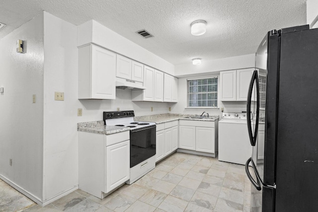 453 County Road 2521, Bonham, TX 75418 - kitchen with freestanding refrigerator, white range with electric cooktop, washer / clothes dryer, under cabinet range hood, and a sink