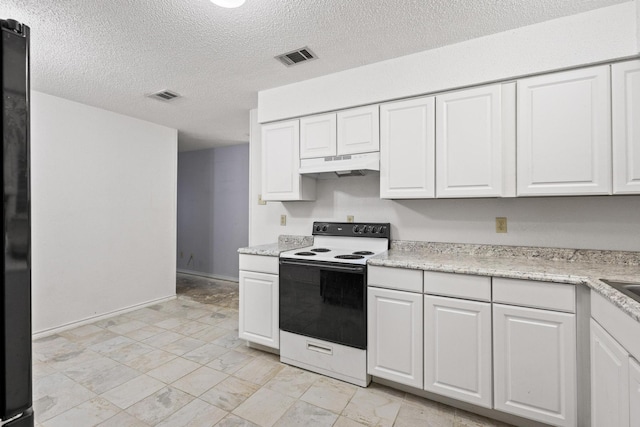 453 County Road 2521, Bonham, TX 75418 - kitchen featuring range with electric stovetop, under cabinet range hood, a textured ceiling, white cabinets, and light marble finish floors