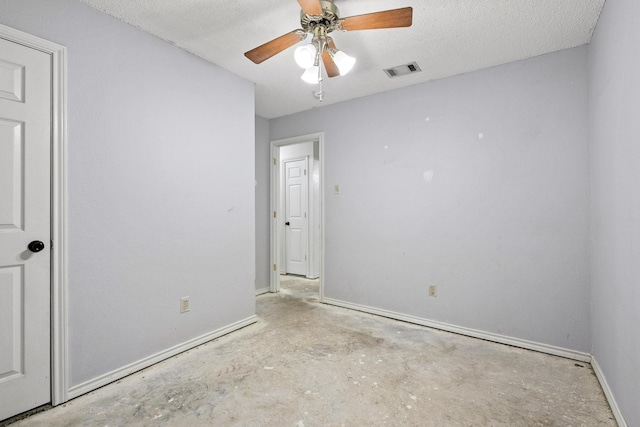 453 County Road 2521, Bonham, TX 75418 - spare room featuring baseboards, unfinished concrete flooring, and a ceiling fan