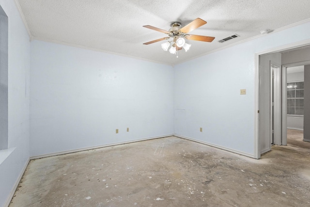 453 County Road 2521, Bonham, TX 75418 - spare room featuring concrete flooring, ornamental molding, ceiling fan, a textured ceiling, and baseboards