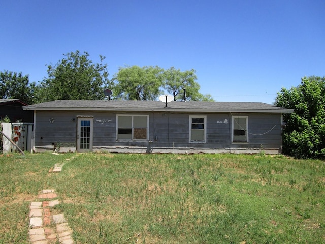 5265 S 7th St, Abilene, TX 79605 - rear view of property with a lawn