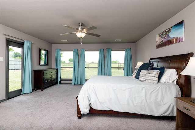 14447 Warbler Ln, Haslet, TX 76052 - bedroom featuring light colored carpet, multiple windows, ceiling fan, and access to outside