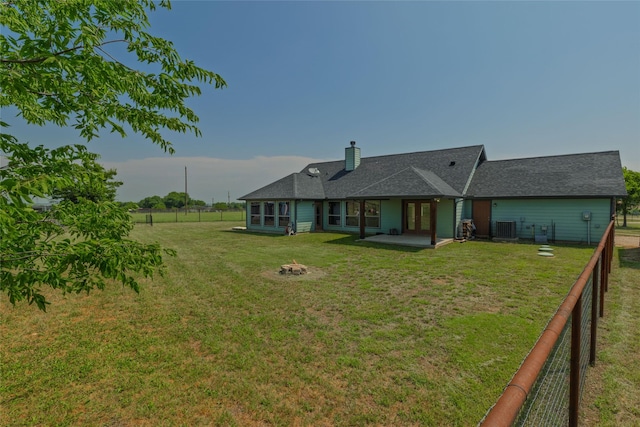 14447 Warbler Ln, Haslet, TX 76052 - back of property featuring an outdoor fire pit, a patio area, a fenced backyard, and a chimney