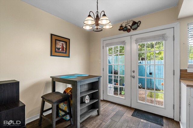 216 Settlers Park Dr, Shreveport, LA 71115 - entryway with french doors, a chandelier, and wood finished floors