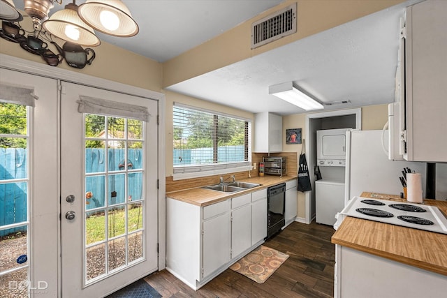 216 Settlers Park Dr, Shreveport, LA 71115 - kitchen featuring stacked washer / drying machine, white appliances, a sink, and plenty of natural light