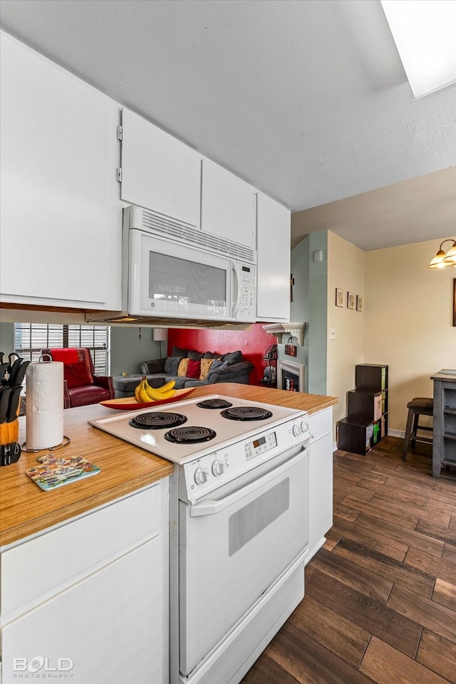 216 Settlers Park Dr, Shreveport, LA 71115 - kitchen with white appliances, light countertops, dark wood-type flooring, and white cabinets
