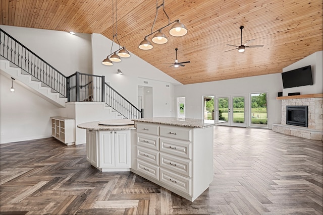 344 Clear Lake Ln, Weatherford, TX 76087 - kitchen featuring high vaulted ceiling, a ceiling fan, a kitchen island, wood ceiling, and open floor plan