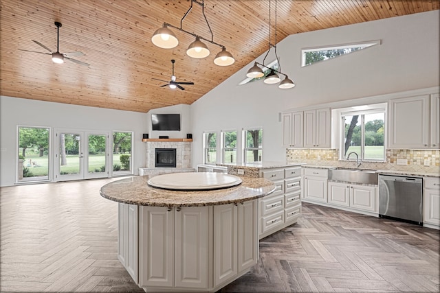 344 Clear Lake Ln, Weatherford, TX 76087 - kitchen with stainless steel dishwasher, a sink, wood ceiling, high vaulted ceiling, and ceiling fan