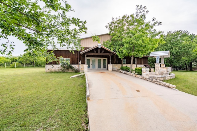 344 Clear Lake Ln, Weatherford, TX 76087 - view of front of house with french doors, stone siding, and driveway