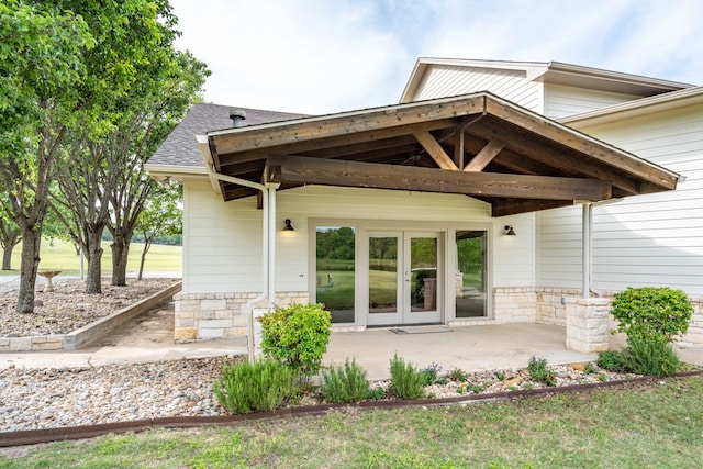 344 Clear Lake Ln, Weatherford, TX 76087 - view of exterior entry featuring french doors and a shingled roof