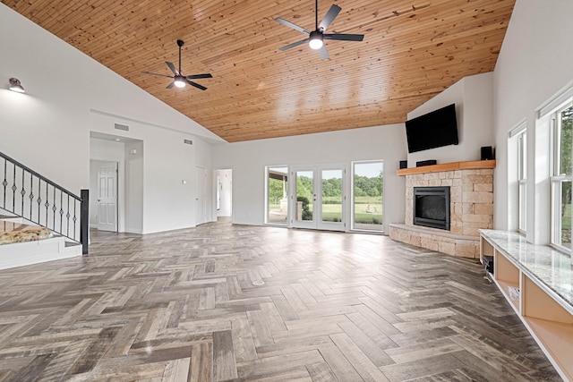 344 Clear Lake Ln, Weatherford, TX 76087 - unfurnished living room featuring high vaulted ceiling, a ceiling fan, a fireplace, plenty of natural light, and stairs