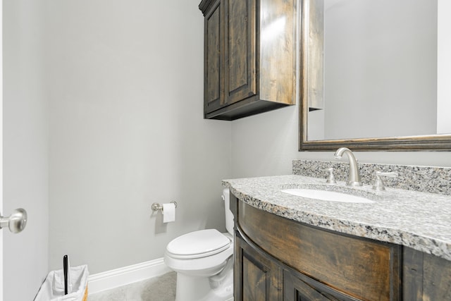 913 Colby Bluff Dr, Rockwall, TX 75087 - half bathroom featuring vanity, baseboards, and toilet
