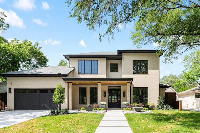 6249 Del Norte Ln, Dallas, TX 75225 - view of front facade with brick siding, an attached garage, driveway, french doors, and a porch