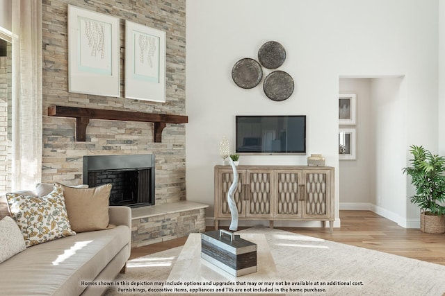 12605 Rocky Top Rd, Godley, TX 76044 - living area featuring wood finished floors, baseboards, and a fireplace