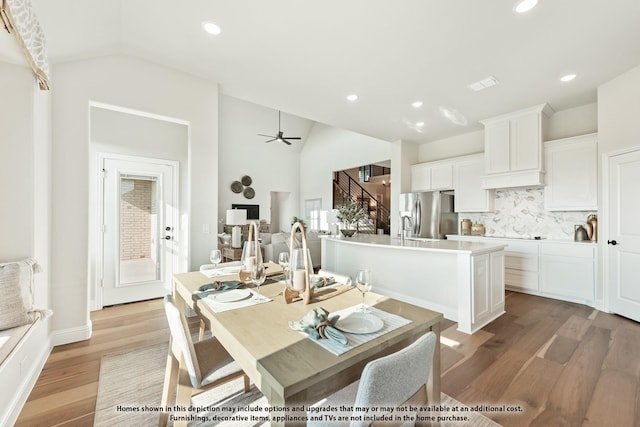 12605 Rocky Top Rd, Godley, TX 76044 - dining area featuring lofted ceiling, light wood-style flooring, stairs, recessed lighting, and ceiling fan