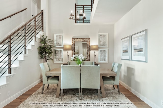 12605 Rocky Top Rd, Godley, TX 76044 - dining room featuring a chandelier, wood finished floors, stairs, a high ceiling, and baseboards