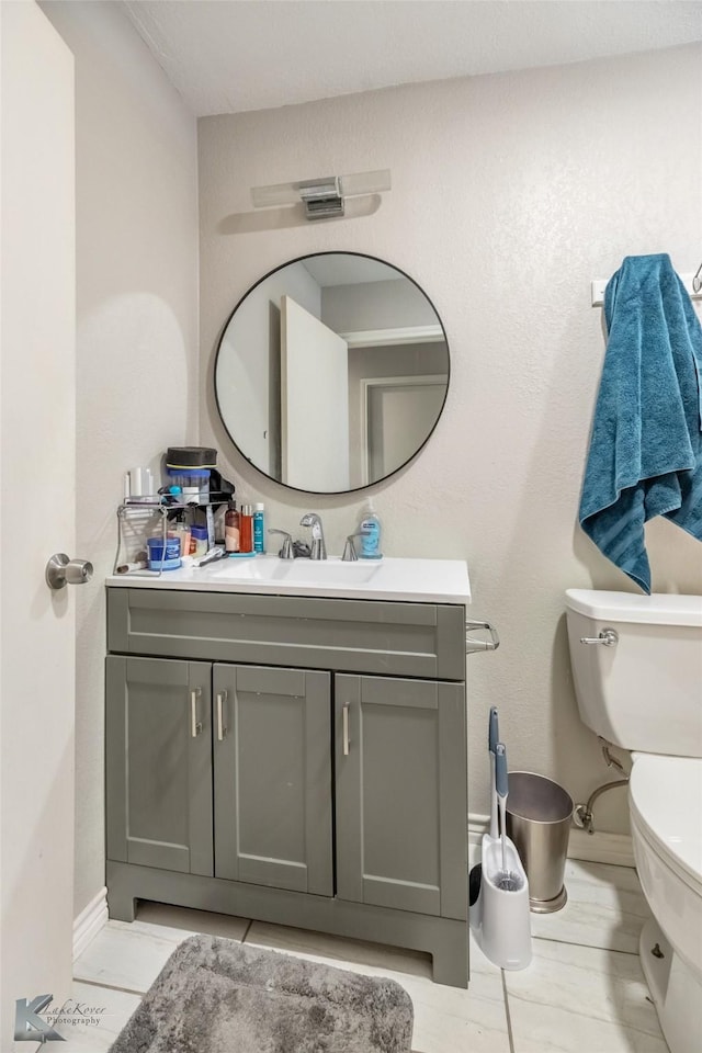 601 Westmoreland St, Abilene, TX 79603 - half bathroom with vanity, toilet, and baseboards