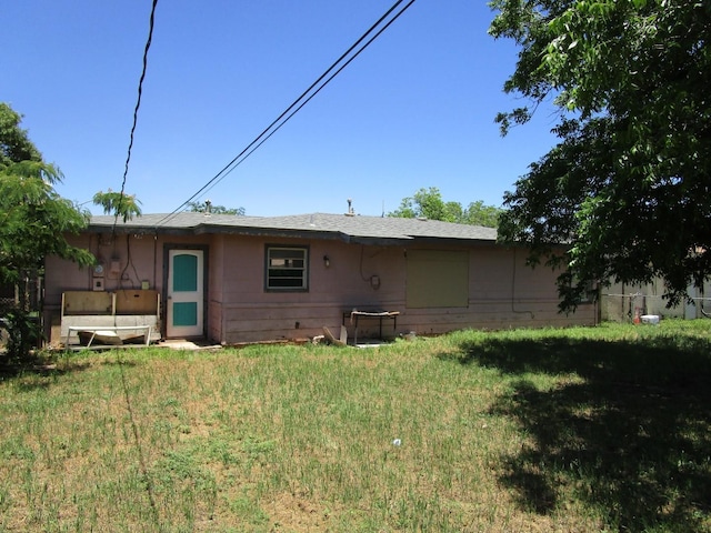 5349 Lamesa Ave, Abilene, TX 79605 - rear view of house featuring a lawn