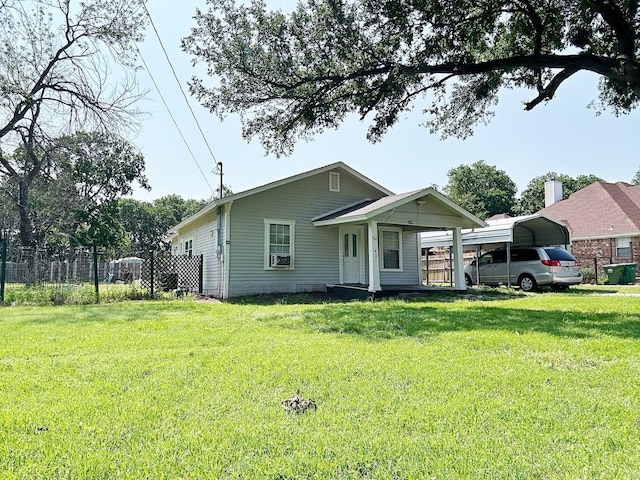 421 Jackson St, Krum, TX 76249 - bungalow-style house featuring a carport