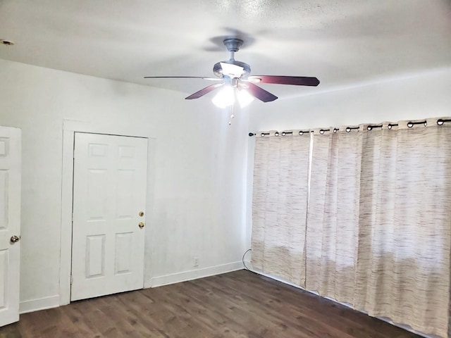 421 Jackson St, Krum, TX 76249 - empty room featuring wood finished floors, a ceiling fan, and baseboards