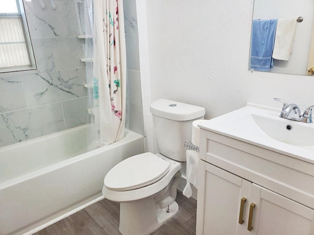 421 Jackson St, Krum, TX 76249 - bathroom with wood finished floors, vanity, toilet, and shower / bathtub combination with curtain