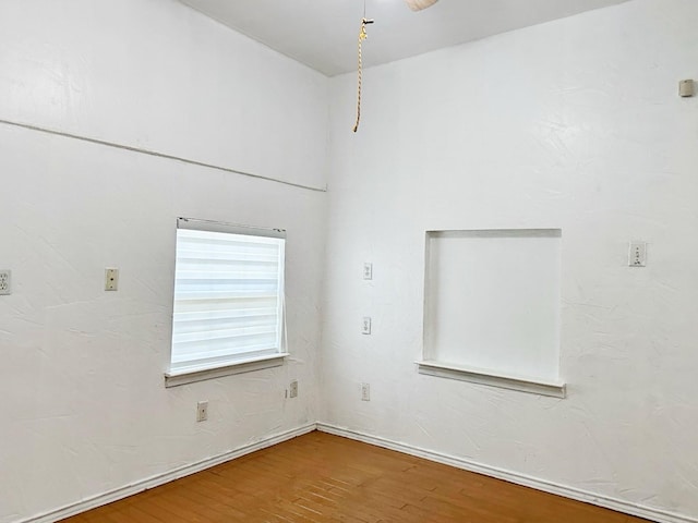 421 Jackson St, Krum, TX 76249 - spare room featuring wood finished floors
