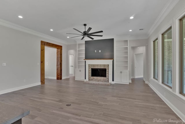 507 Cocodrie Dr, Bossier City, LA 71112 - unfurnished living room with a ceiling fan, ornamental molding, recessed lighting, baseboards, and wood finished floors