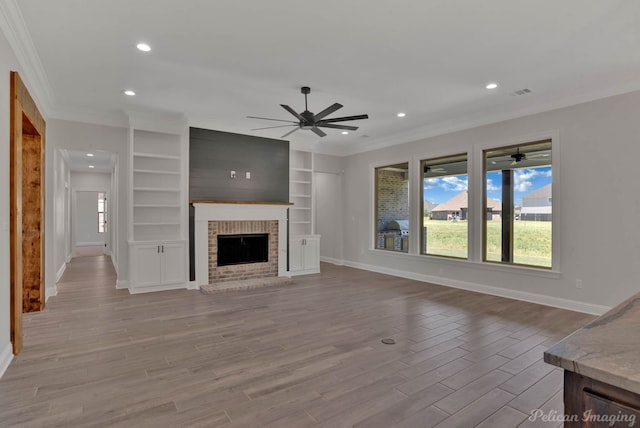 507 Cocodrie Dr, Bossier City, LA 71112 - unfurnished living room with a ceiling fan, ornamental molding, baseboards, wood finished floors, and recessed lighting