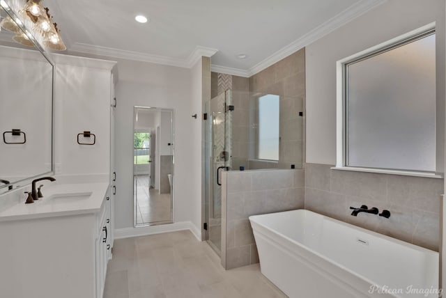 507 Cocodrie Dr, Bossier City, LA 71112 - bathroom featuring vanity, a soaking tub, a stall shower, tile patterned flooring, and ornamental molding
