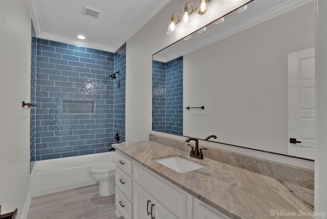 507 Cocodrie Dr, Bossier City, LA 71112 - bathroom featuring ornamental molding, vanity, toilet, shower / tub combination, and wood finished floors