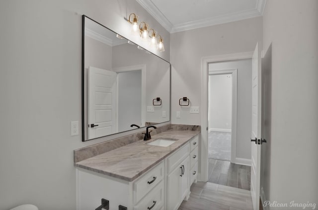 507 Cocodrie Dr, Bossier City, LA 71112 - bathroom featuring vanity, crown molding, wood finished floors, and baseboards