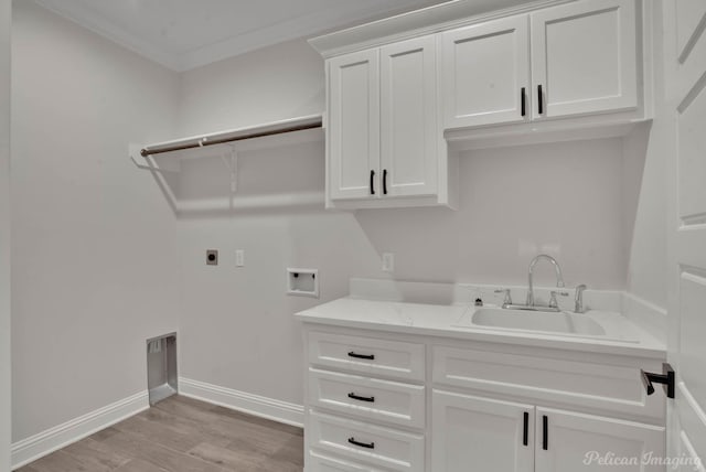 507 Cocodrie Dr, Bossier City, LA 71112 - laundry room featuring hookup for an electric dryer, washer hookup, cabinet space, light wood-style flooring, and baseboards