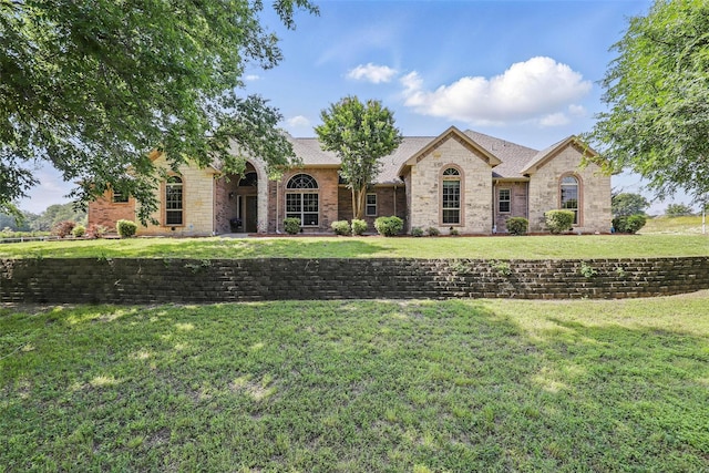 104 E Hidden Meadow Ct, Cresson, TX 76035 - view of front of property featuring a front yard, stone siding, and brick siding