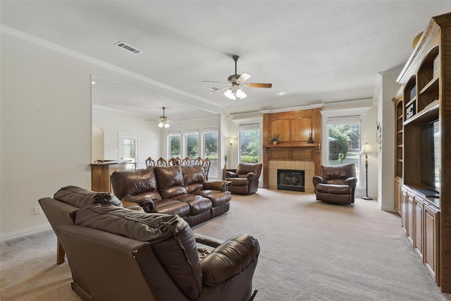 104 E Hidden Meadow Ct, Cresson, TX 76035 - living room with light colored carpet, a ceiling fan, a fireplace, crown molding, and baseboards