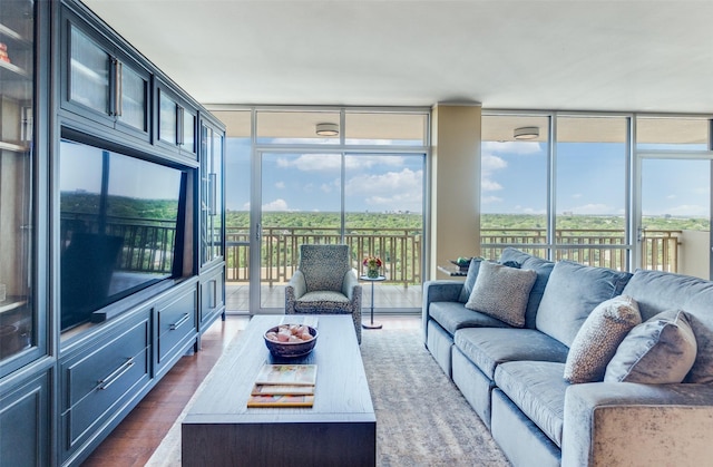 6211 W NW Hwy Unit 1504, Dallas, TX 75225 - living room with floor to ceiling windows and dark wood-type flooring