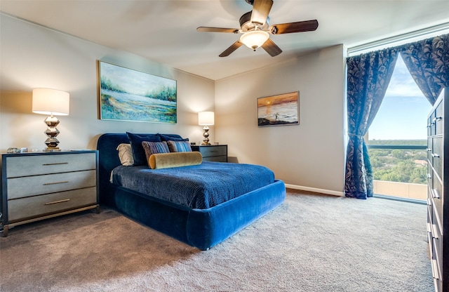 6211 W NW Hwy Unit 1504, Dallas, TX 75225 - bedroom with carpet flooring, baseboards, and ceiling fan