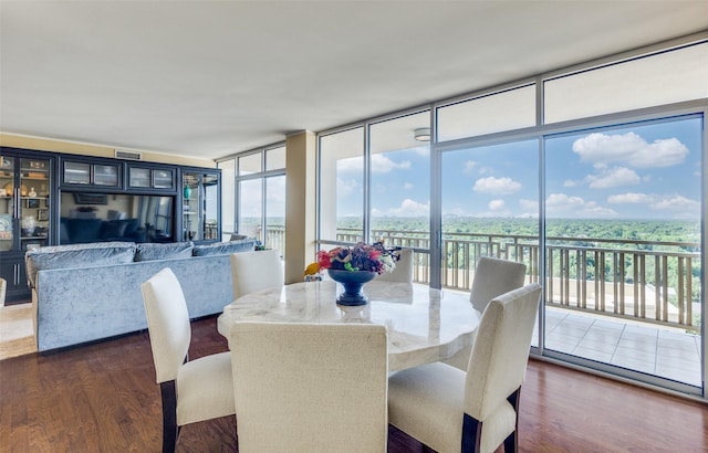 6211 W NW Hwy Unit 1504, Dallas, TX 75225 - dining room featuring dark wood-style flooring, healthy amount of natural light, and a wall of windows