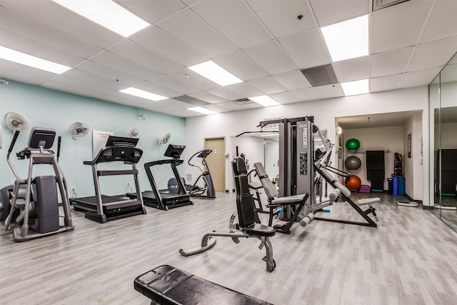 6211 W NW Hwy Unit 1504, Dallas, TX 75225 - gym with wood finished floors and a paneled ceiling