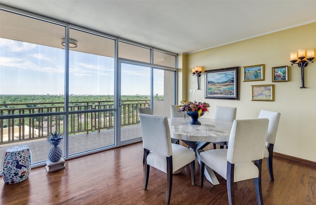 6211 W NW Hwy Unit 1504, Dallas, TX 75225 - dining space featuring floor to ceiling windows, wood finished floors, and baseboards