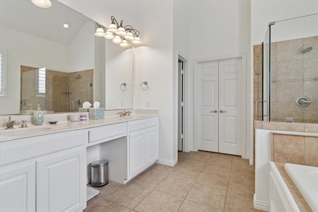 1127 Westminster Ave, Murphy, TX 75094 - full bathroom with a stall shower, double vanity, tile patterned flooring, and a garden tub