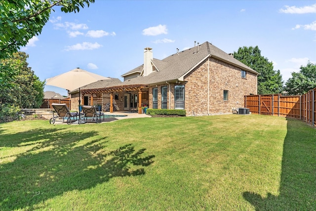 1127 Westminster Ave, Murphy, TX 75094 - rear view of property featuring brick siding, a patio area, a chimney, central AC, and roof with shingles