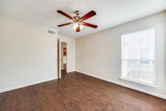 14277 Preston Rd Unit 524, Dallas, TX 75254 - spare room with ceiling fan, baseboards, and dark wood-type flooring