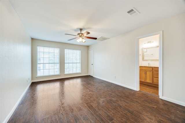 14277 Preston Rd Unit 524, Dallas, TX 75254 - unfurnished room with a ceiling fan, dark wood-type flooring, and baseboards