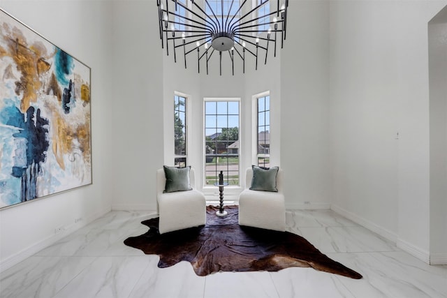 9320 Vista Cir, Irving, TX 75063 - living area featuring marble look tiles, baseboards, and a towering ceiling