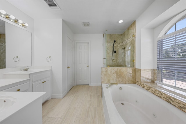 9320 Vista Cir, Irving, TX 75063 - full bathroom featuring a shower stall, a tub with jets, vanity, recessed lighting, and baseboards