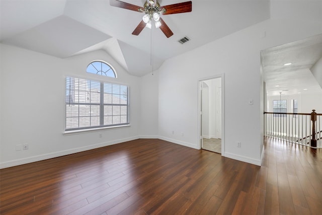 9320 Vista Cir, Irving, TX 75063 - empty room with a ceiling fan, lofted ceiling, dark wood-style floors, and baseboards