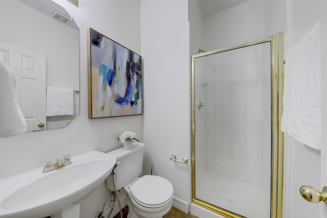 9320 Vista Cir, Irving, TX 75063 - bathroom with a sink, a stall shower, and toilet
