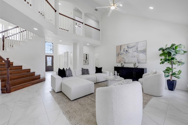 9320 Vista Cir, Irving, TX 75063 - living room featuring marble look tile flooring, stairway, a towering ceiling, a ceiling fan, and recessed lighting
