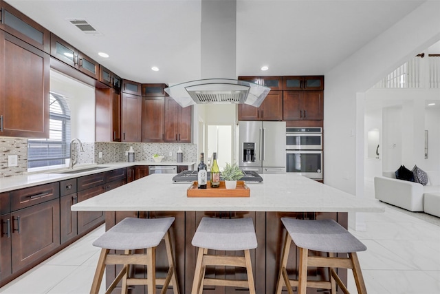 9320 Vista Cir, Irving, TX 75063 - kitchen featuring stainless steel appliances, a sink, island range hood, decorative backsplash, and light tile patterned floors